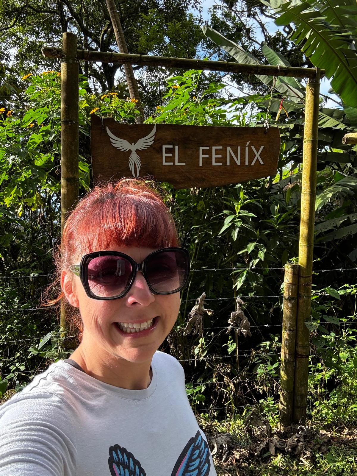 A selfie beside the El Fénix entrance sign